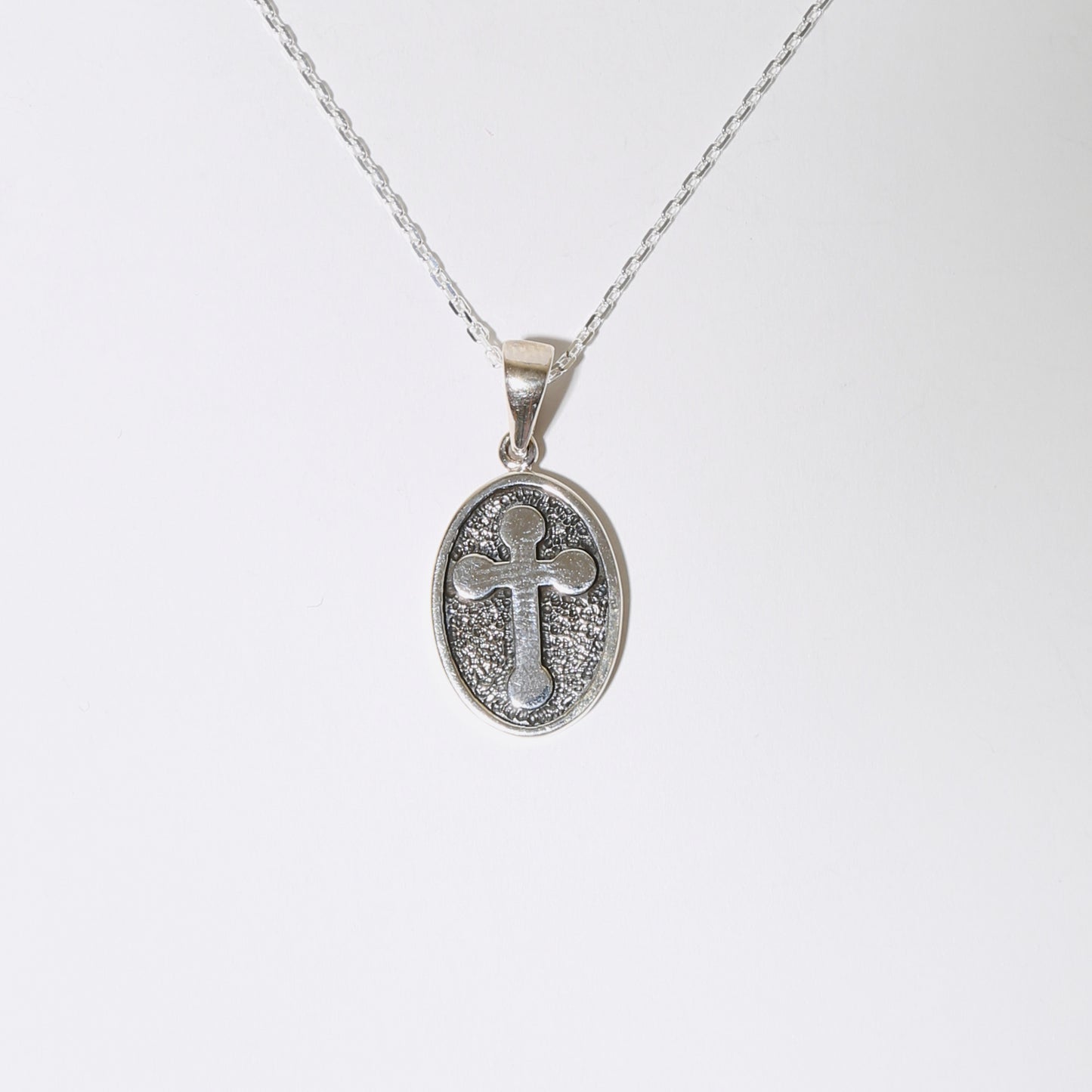 Sterling Silver Cross in Oval Necklace